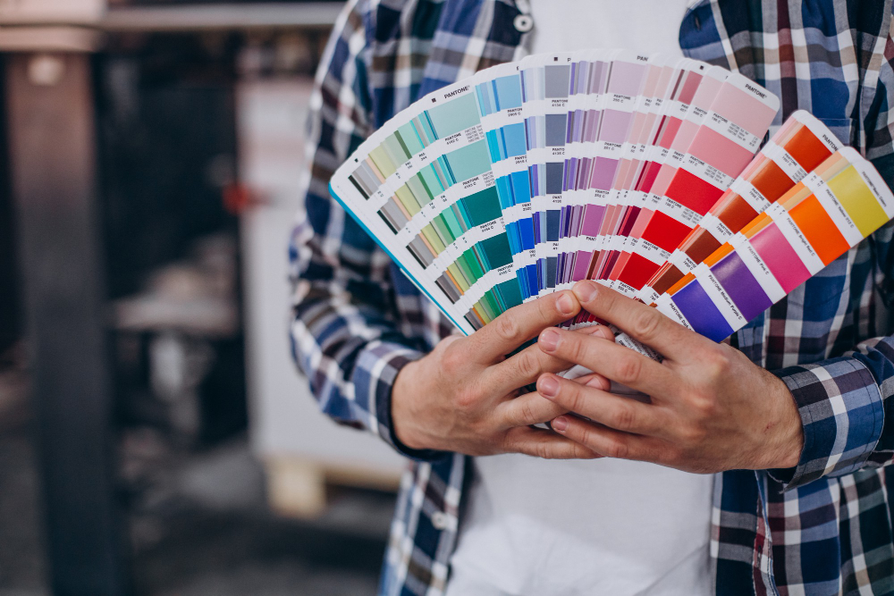 man-working-printing-house-with-paper-paints https://renfrewpainting.com/wp-content/uploads/2022/04/man-working-printing-house-with-paper-paints.jpg